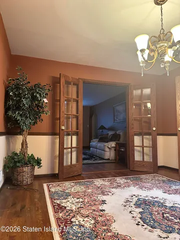 a bathroom with a granite countertop toilet sink and mirror