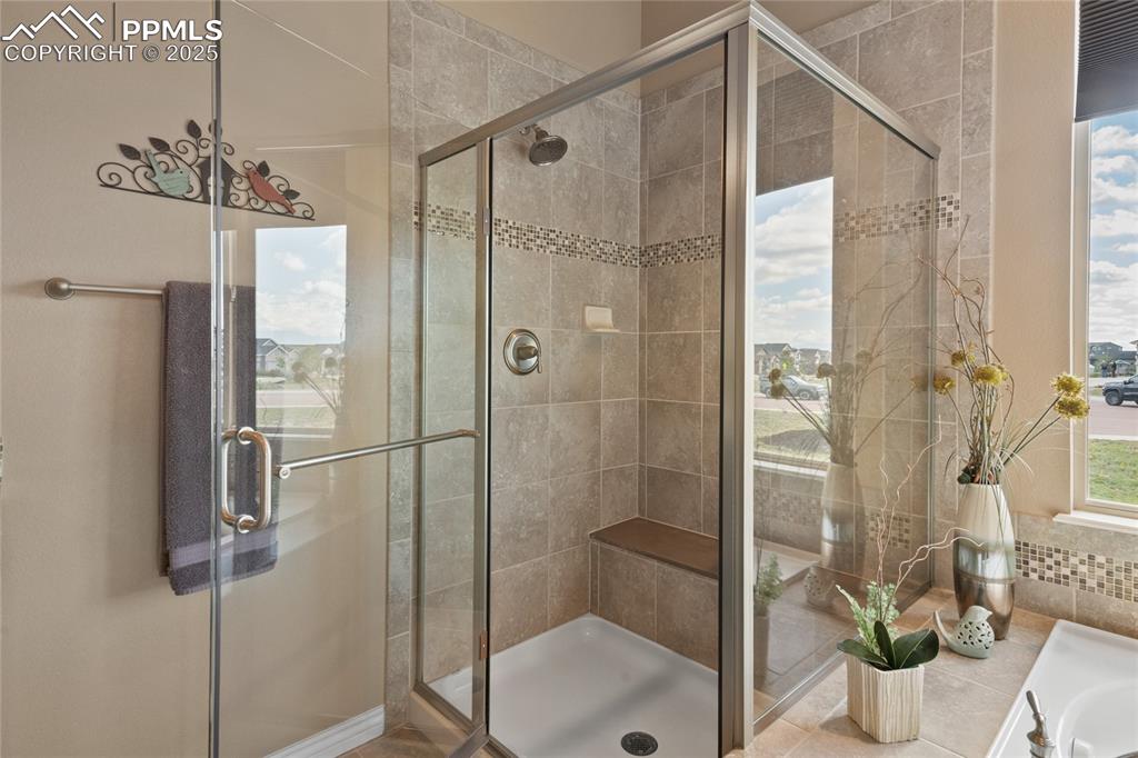 3718 Sky Rim Court Colorado Springs, CO 80908 - Photo 28 of 49 a bathroom with a shower and a sink