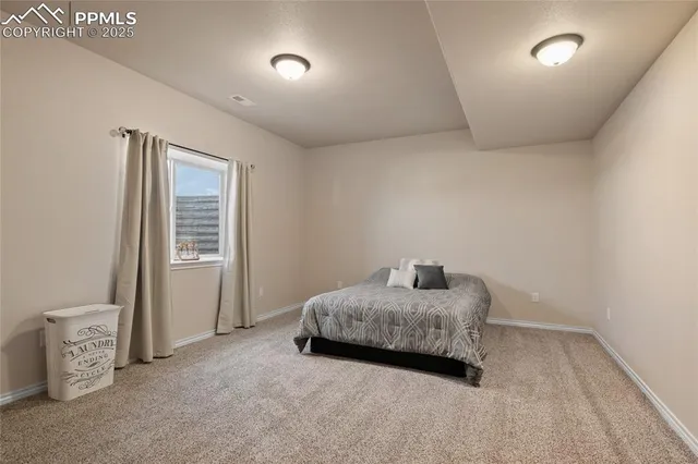 a bathroom with a toilet a sink a mirror a shower and vanity