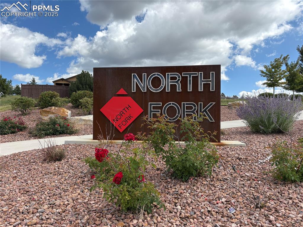 3718 Sky Rim Court Colorado Springs, CO 80908 - Photo 7 of 49 a sign that is on the side of a building
