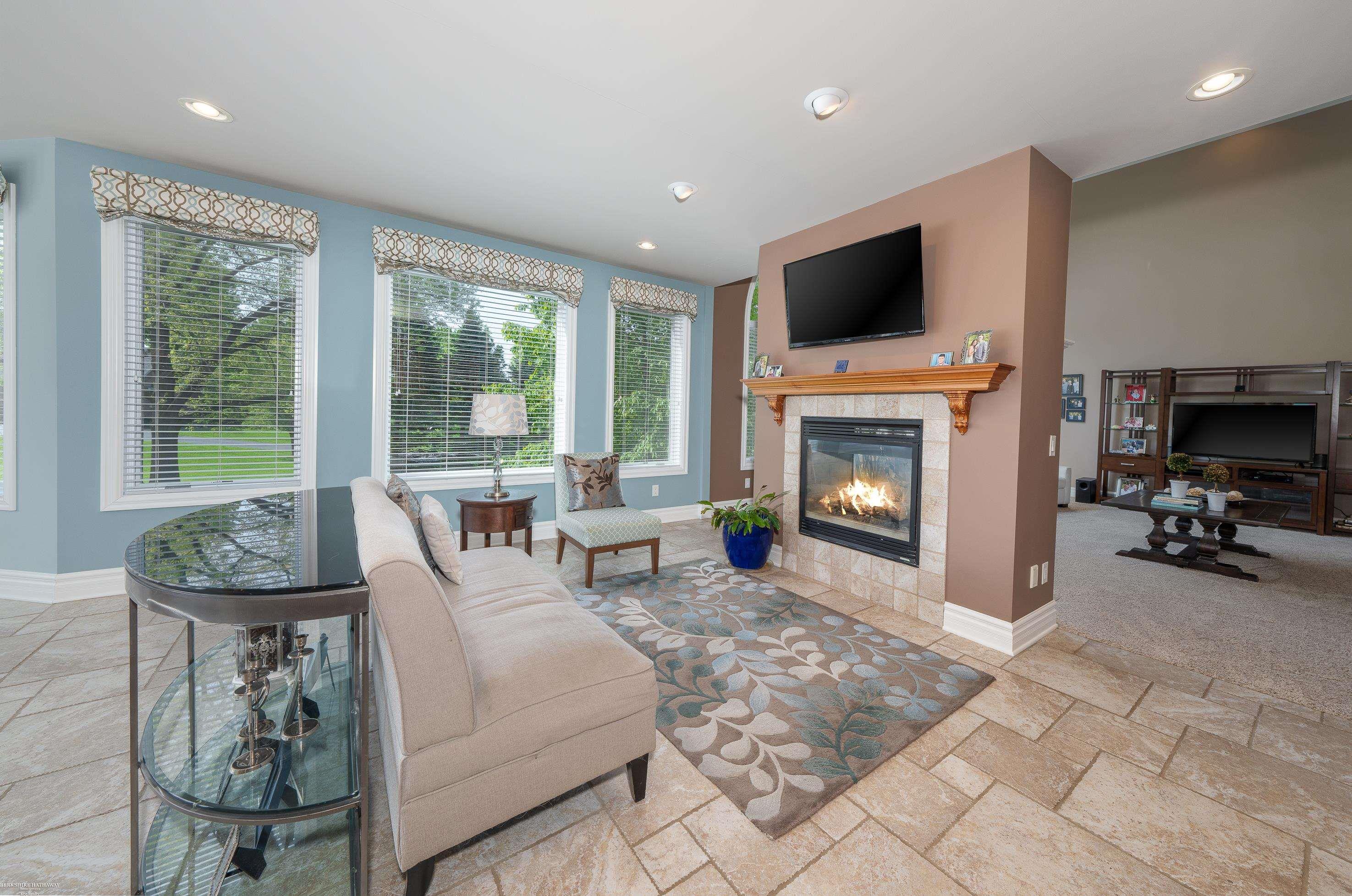 4372 Timber Ridge Drive Romeo, MI 48065 - Photo 20 of 84 In the Kitchen, Travertine Flooring & Gas Fireplace (2-Way