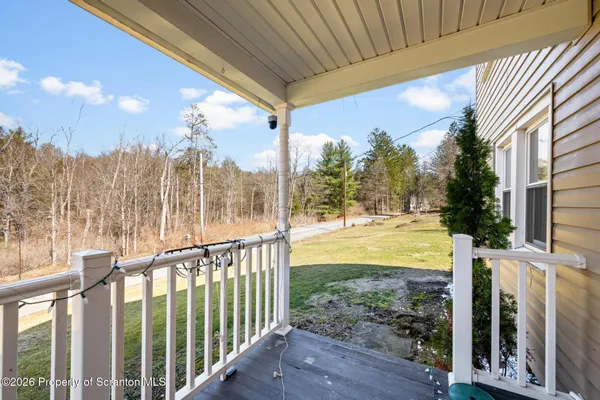 a view of a porch with a backyard