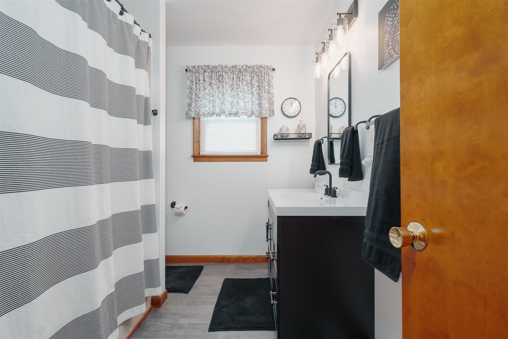 32931 East 1000 N Road Chatsworth, IL 60921 - Photo 13 of 42 a bathroom with a sink a mirror a vanity and shower