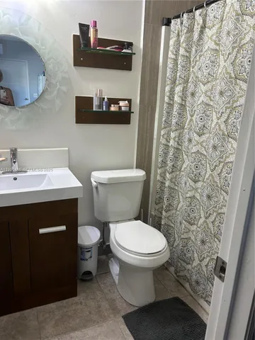 a bathroom with a toilet and a sink