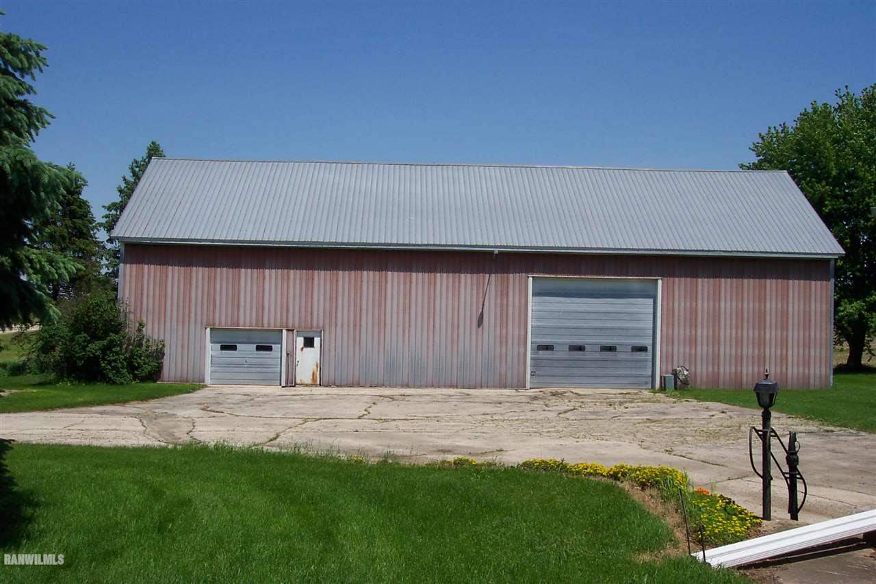4657 North Illinois Route Forreston, IL 61030 - Photo 4 of 39 a front view of a house with a yard