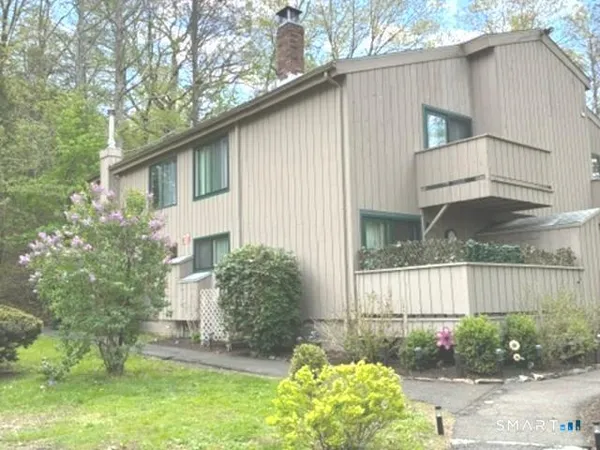 a house view with a garden space