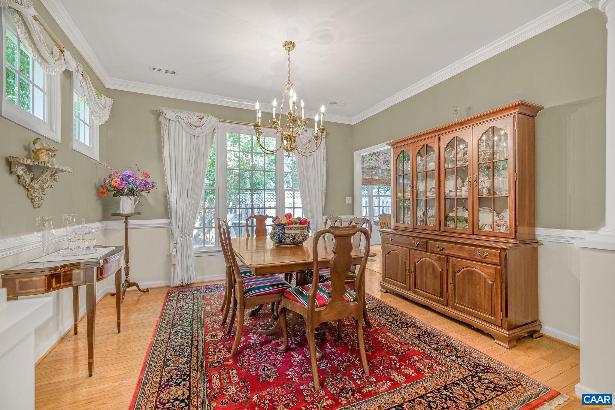 2111 Shepherds Ridge Road Charlottesville, VA 22901 - Photo 12 of 31 a view of a dining room with furniture window and wooden floor