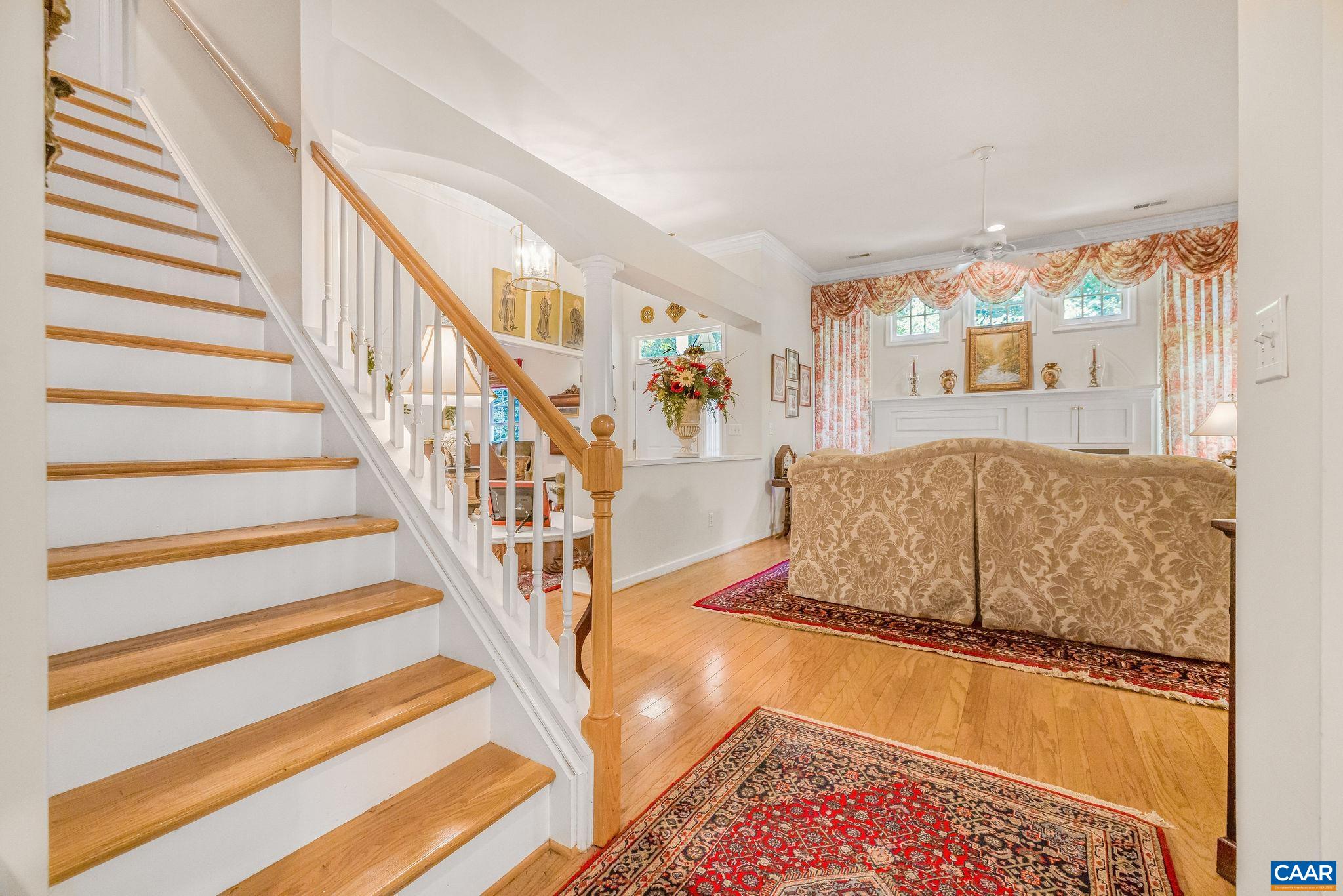 2111 Shepherds Ridge Road Charlottesville, VA 22901 - Photo 13 of 31 a living room with a couch and a dining table