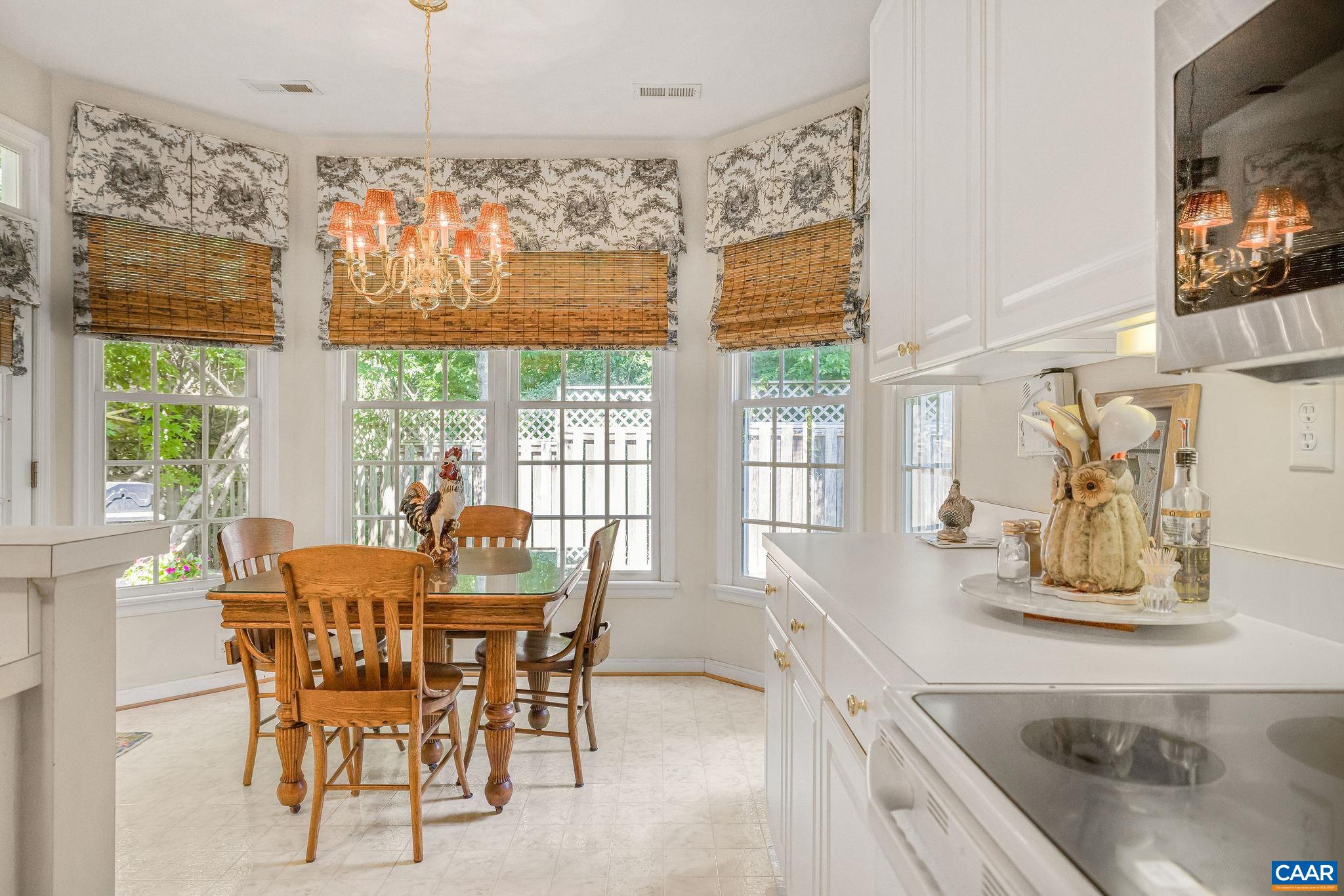 2111 Shepherds Ridge Road Charlottesville, VA 22901 - Photo 16 of 31 a dining room with furniture a chandelier and window