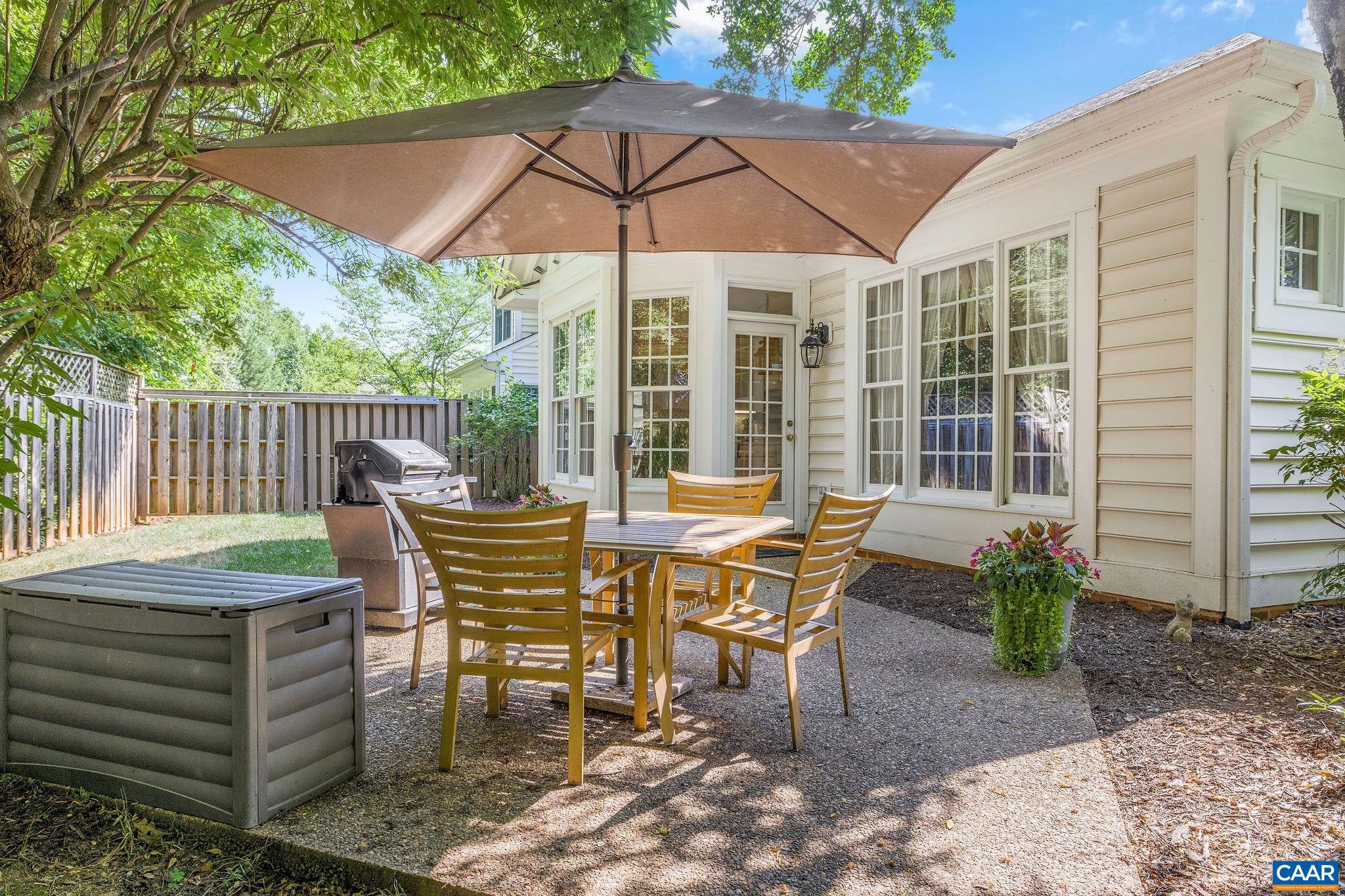 2111 Shepherds Ridge Road Charlottesville, VA 22901 - Photo 24 of 31 a view of a patio with table and chairs under an umbrella