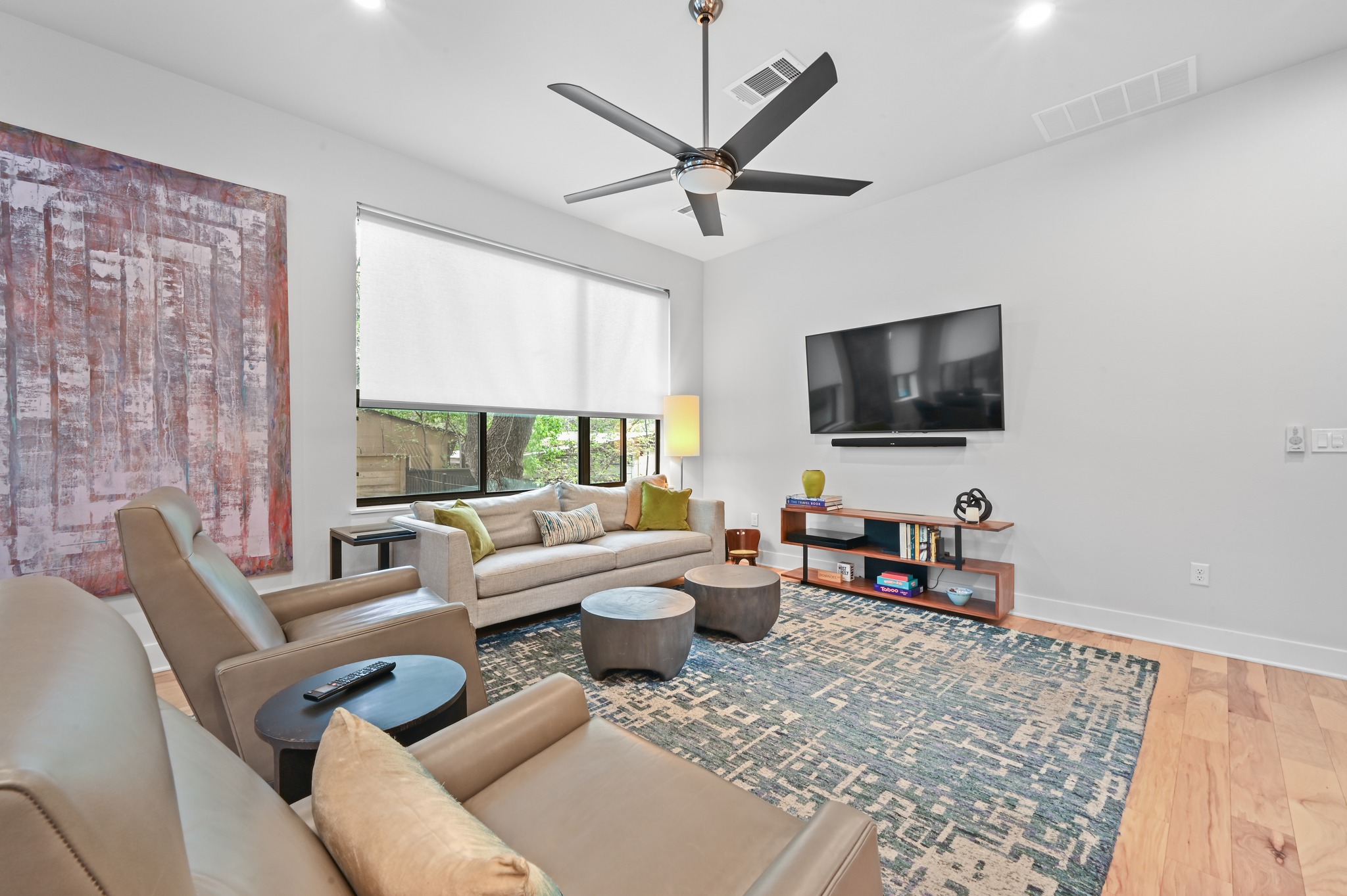3115 Clawson Road, Unit 201 Austin, TX 78704 - Photo 12 of 38 a living room with furniture a flat screen tv and a large window