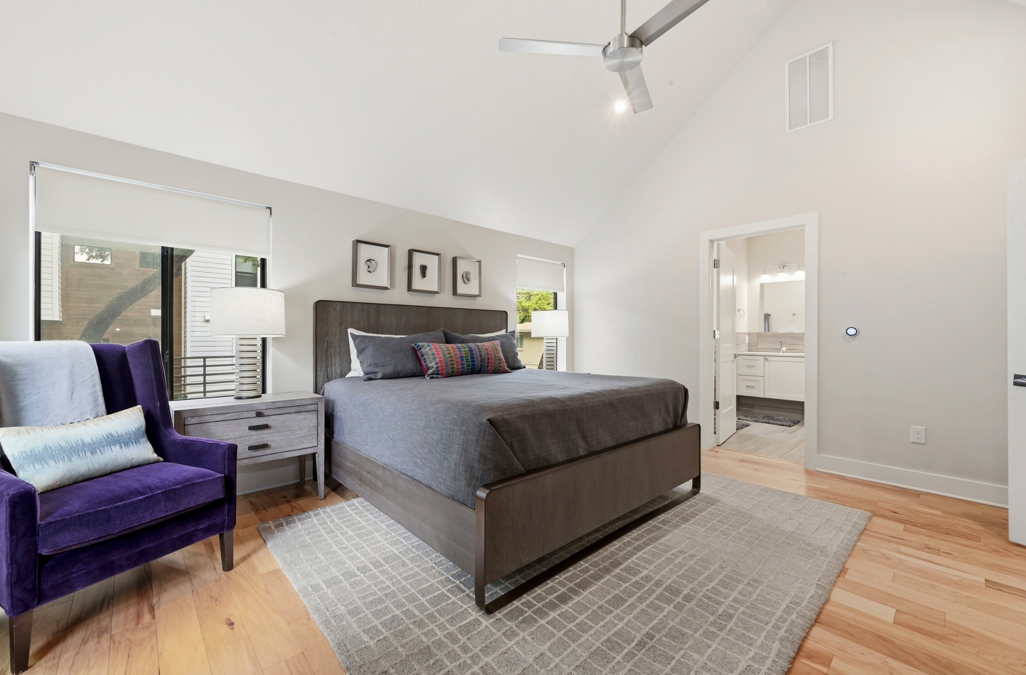 3115 Clawson Road, Unit 201 Austin, TX 78704 - Photo 17 of 34 Spacious room featuring vaulted ceilings, wood-finish flooring, and ample natural light through large windows