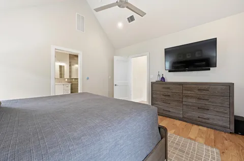 a living room with a flat screen tv and a couch