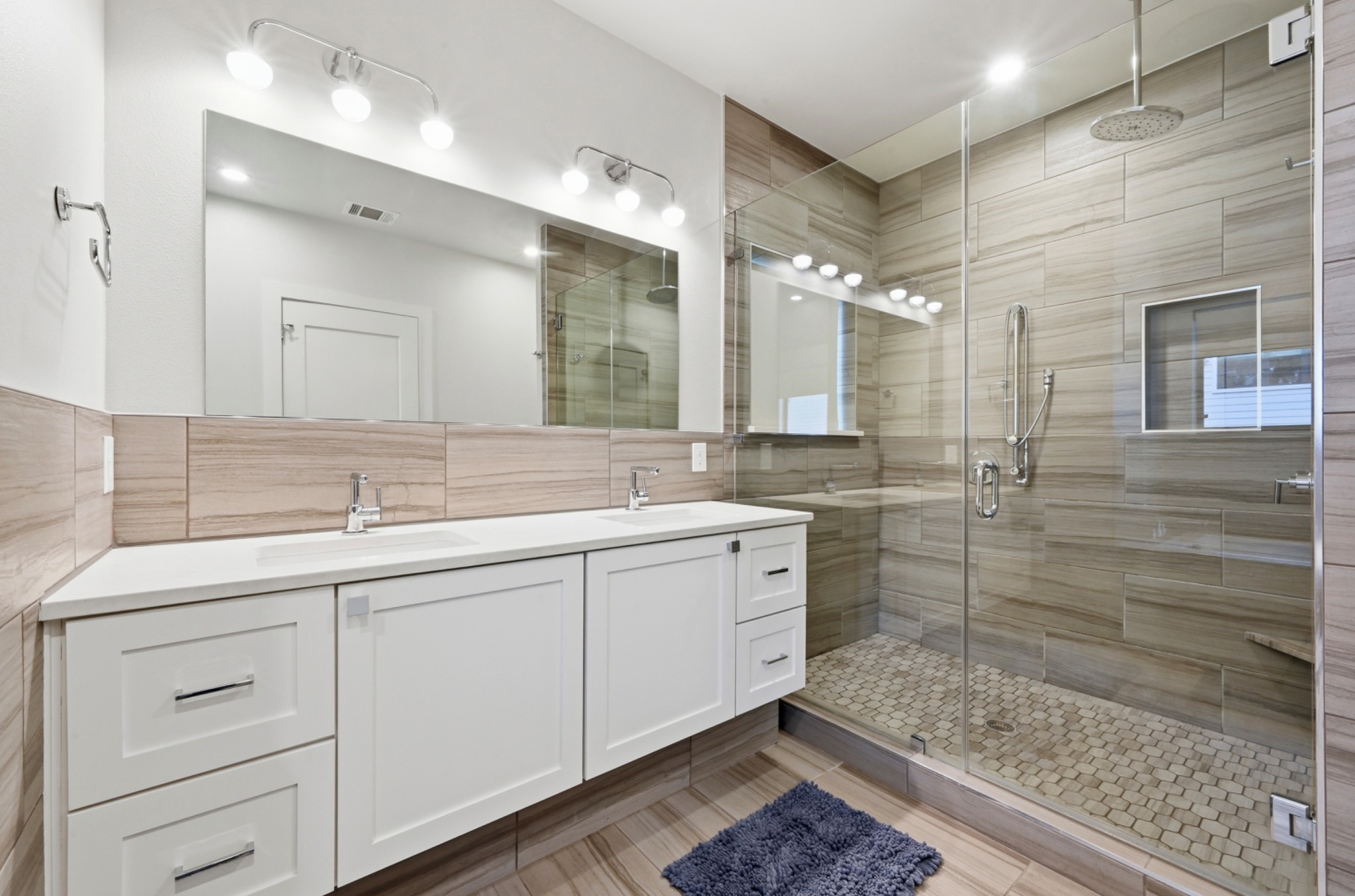 3115 Clawson Road, Unit 201 Austin, TX 78704 - Photo 21 of 38 a bathroom with a double vanity sink mirror and shower