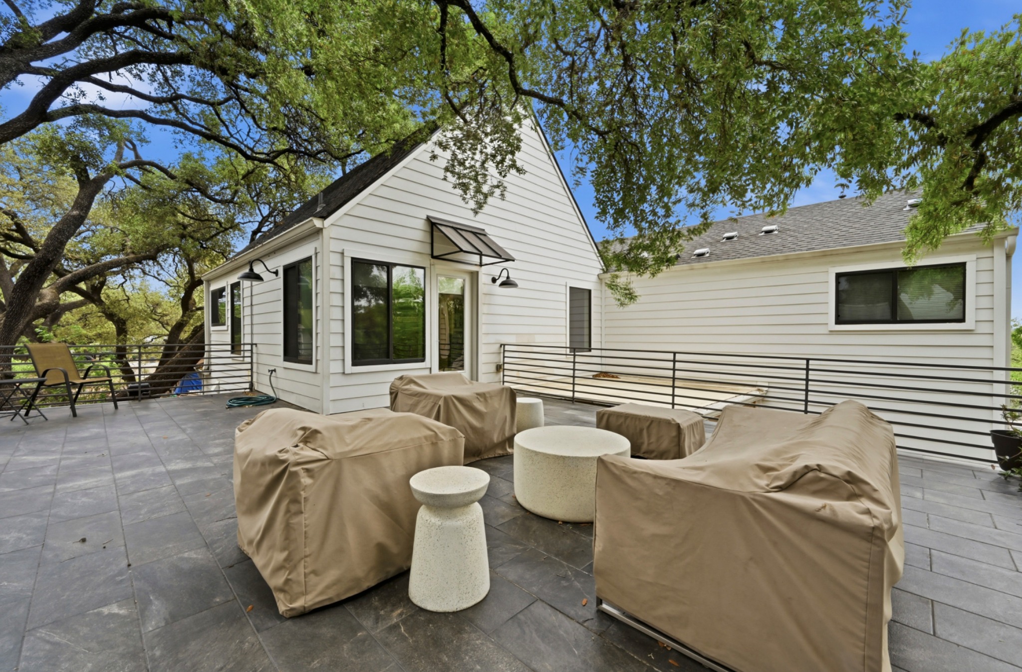 3115 Clawson Road, Unit 201 Austin, TX 78704 - Photo 27 of 38 a view of a patio with couches table and chairs and wooden fence