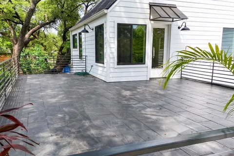 a view of a house with a chairs in patio