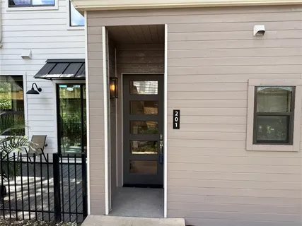 a view of a door and a window