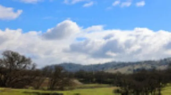 a view of a city with mountains in the background