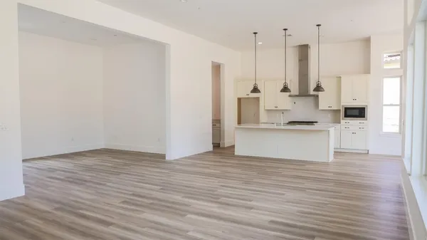 a view of kitchen with wooden floor