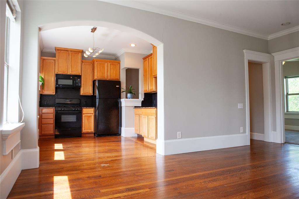 a view of a kitchen with a refrigerator and a stove