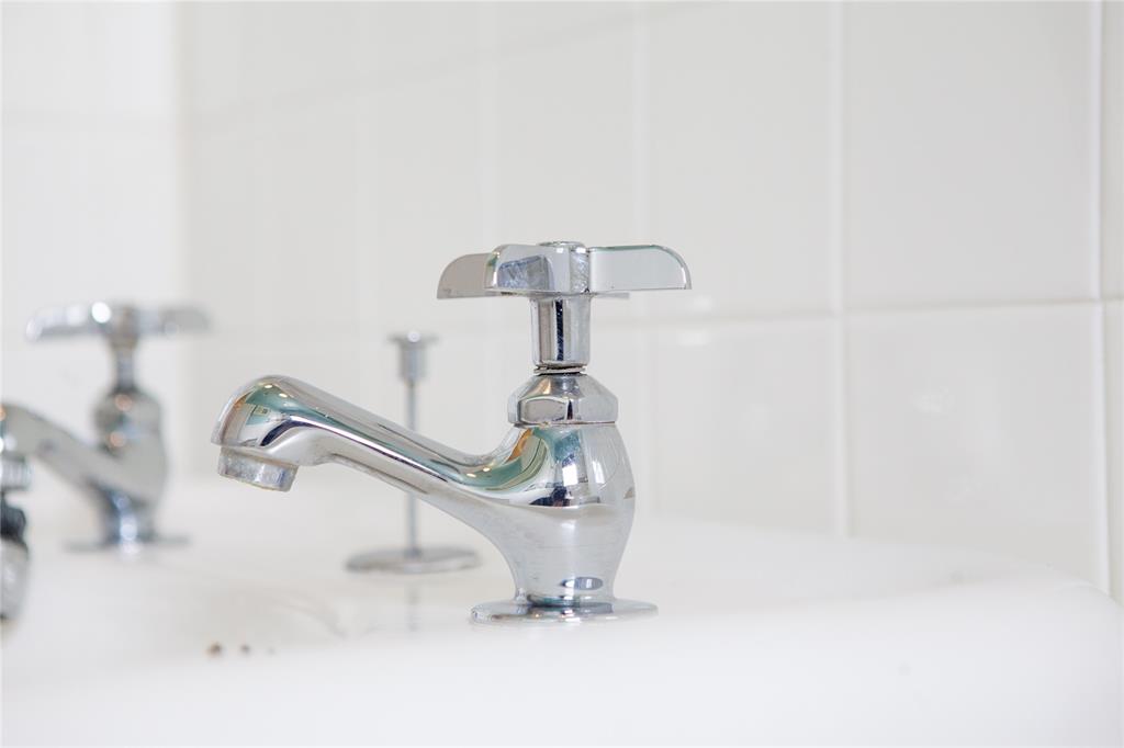 5347 Lewis Street, Unit 5345 Dallas, TX 75206 - Photo 24 of 37 Gleaming vintage faucets on the pedestal sink.