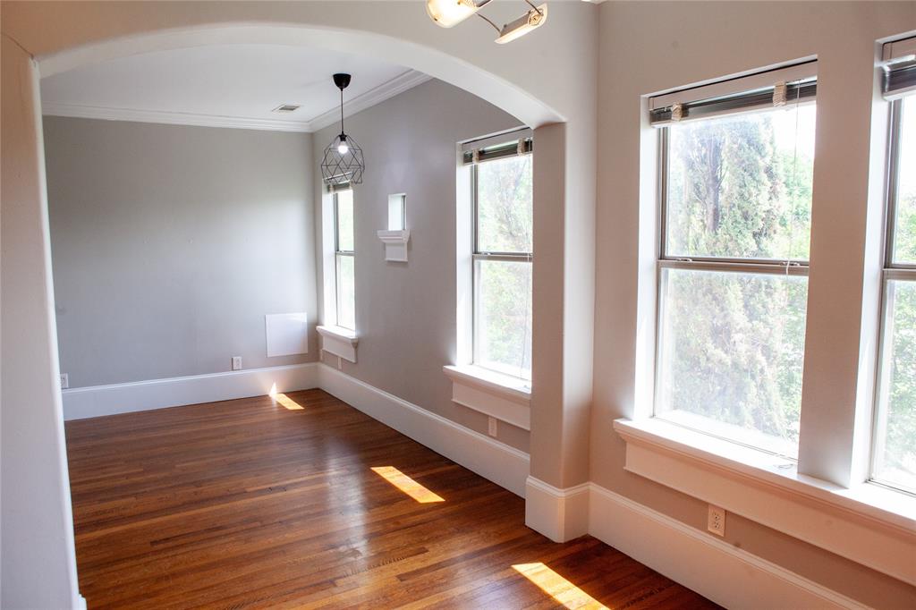 5347 Lewis Street, Unit 5345 Dallas, TX 75206 - Photo 3 of 37 a view of empty room with wooden floor and fan