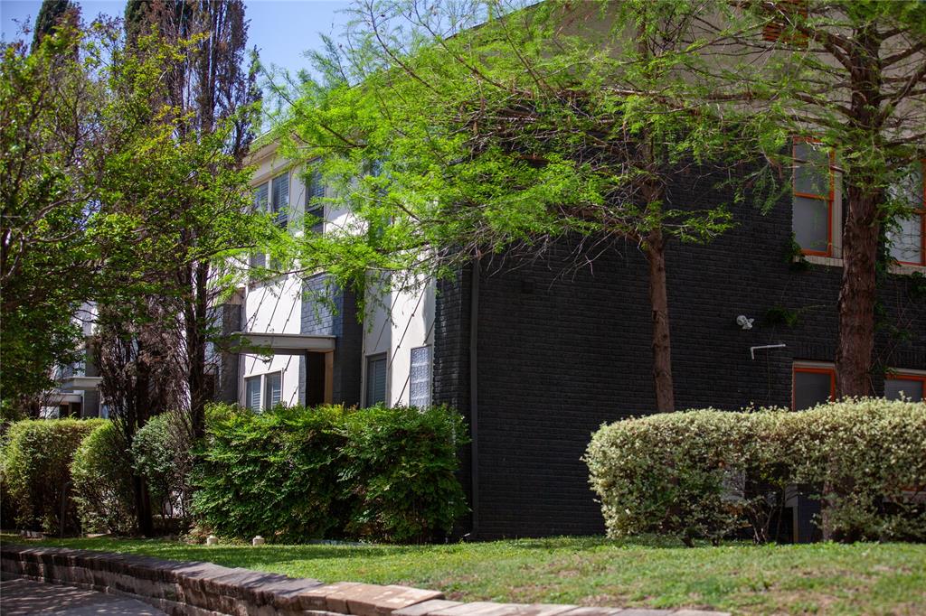 5347 Lewis Street, Unit 5345 Dallas, TX 75206 - Photo 35 of 37 a front view of a house with a yard