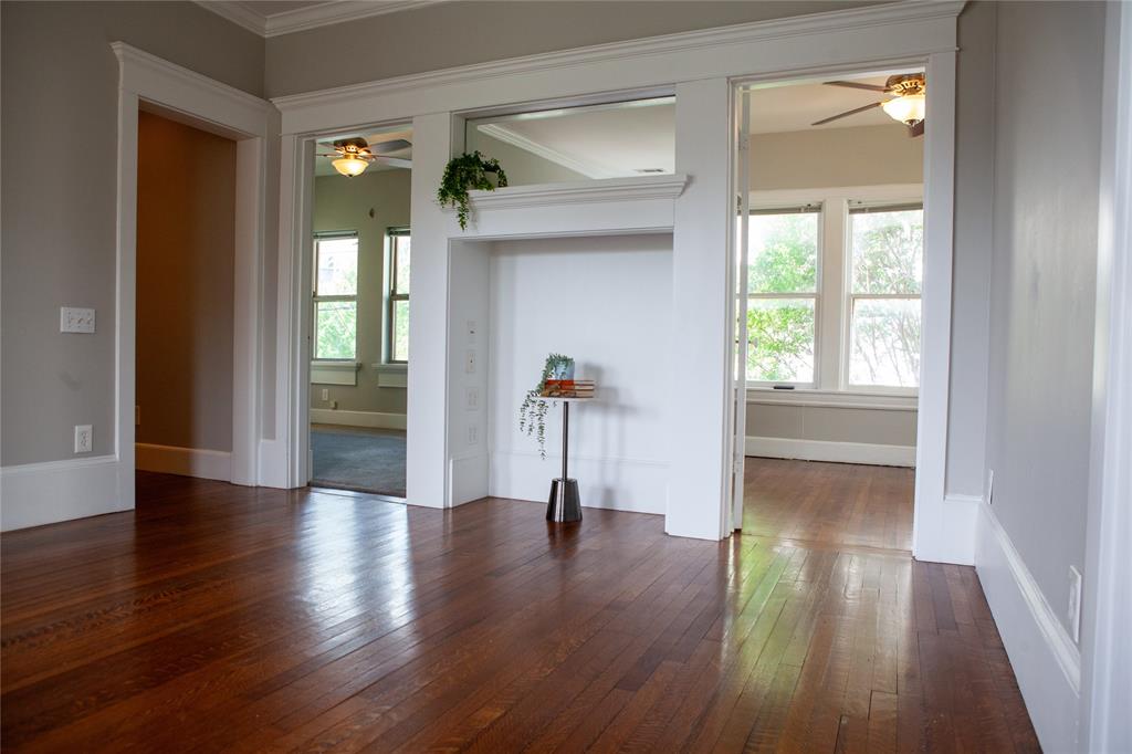 5347 Lewis Street, Unit 5345 Dallas, TX 75206 - Photo 4 of 37 Flanked by both bedrooms, the fireplace-turned-nook is perfect for an entertainment center, record player or bookshelves.