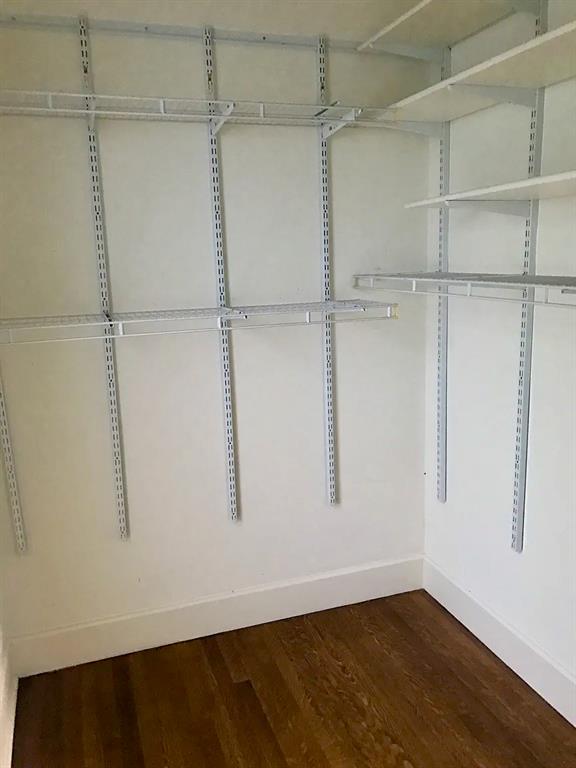 5347 Lewis Street, Unit 5345 Dallas, TX 75206 - Photo 6 of 32 Large walk-in closet with a window in the primary bedroom.