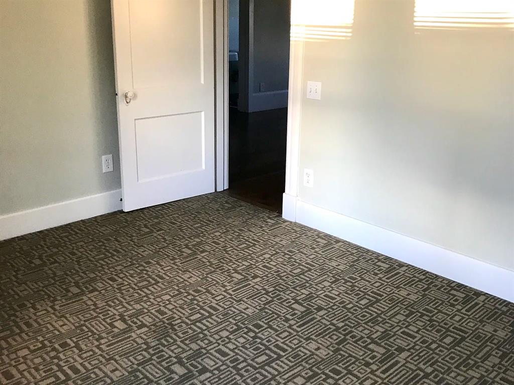 5347 Lewis Street, Unit 5345 Dallas, TX 75206 - Photo 7 of 32 Low-pile carpeting with modern design in the second bedroom reduces noise for extra-deep sleep.