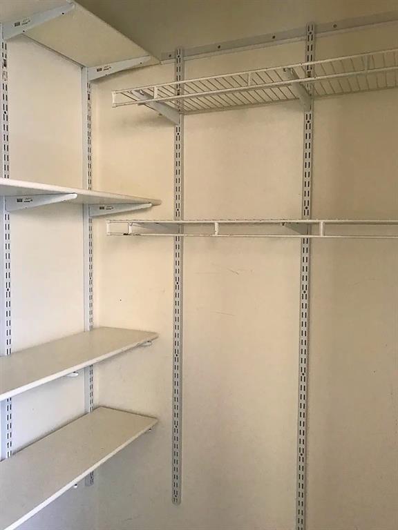 5347 Lewis Street, Unit 5345 Dallas, TX 75206 - Photo 10 of 32 Custom, adjustable shelving in the secondary bedroom's closet.