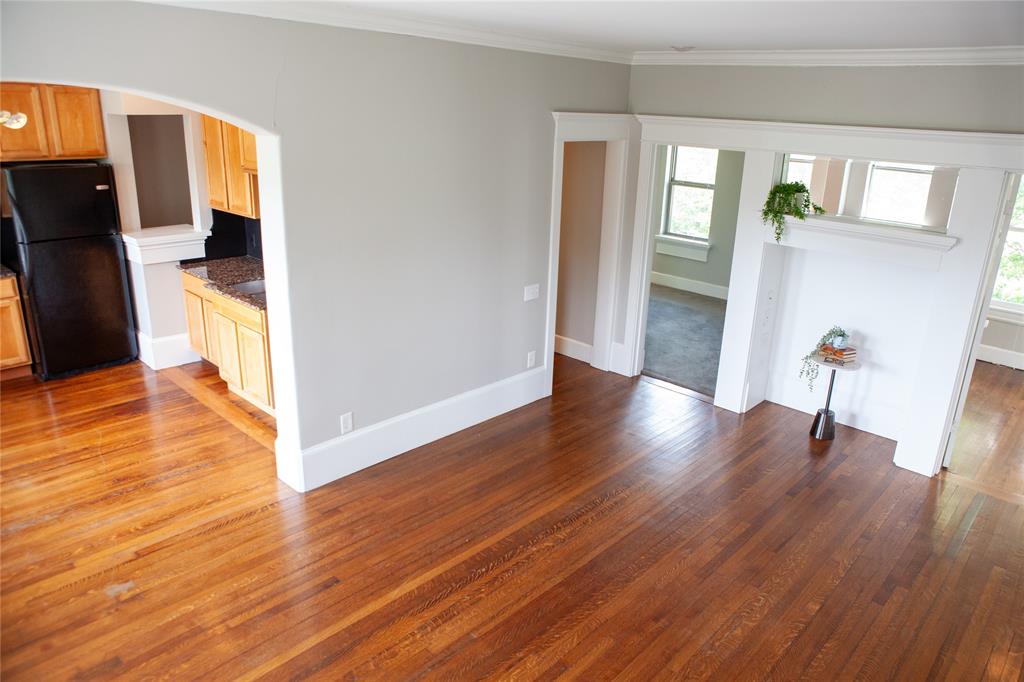5347 Lewis Street, Unit 5345 Dallas, TX 75206 - Photo 10 of 37 a view of a hallway with wooden floor and a living room