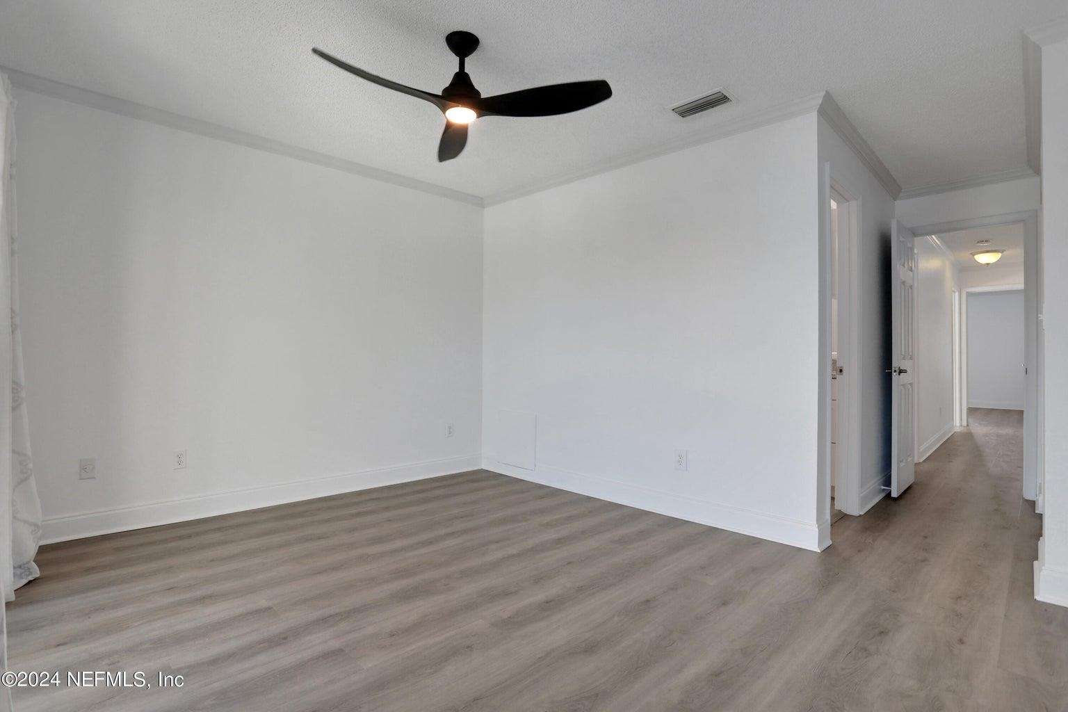 120 Sunset Harbor Way, Unit 206 St. Augustine, FL 32080 - Photo 25 of 54 wooden floor in an empty room