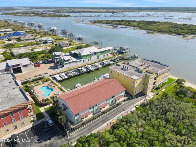 an aerial view of a city with ocean view