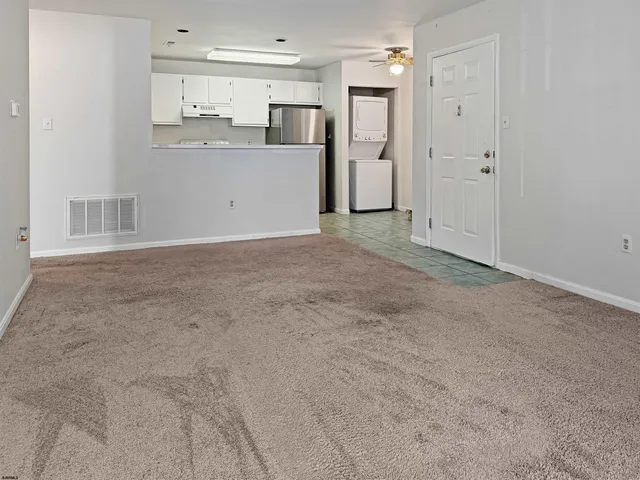 a utility room with a sink washer and dryer