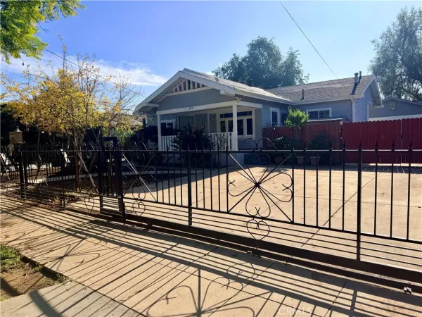 a view of a house with a wooden deck