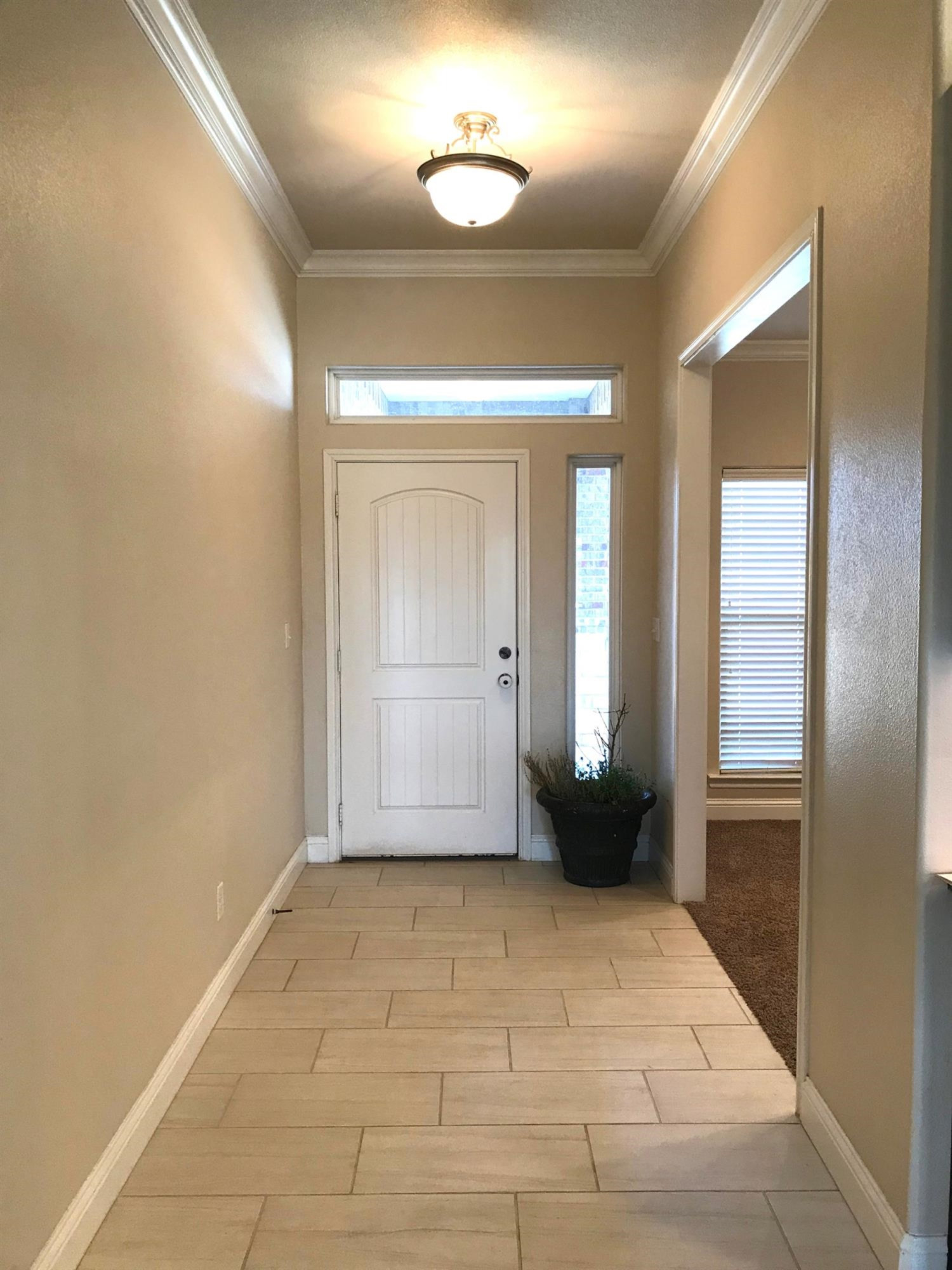 3641 Ridgely Lubbock, TX 79407 - Photo 2 of 10 a view of a hallway with wooden shelves