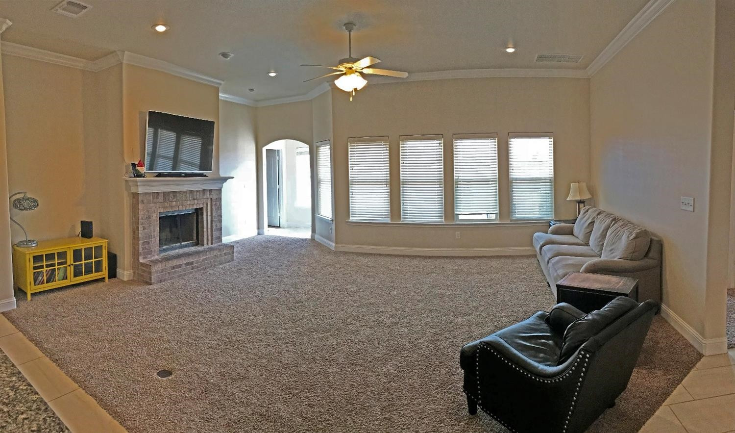3641 Ridgely Lubbock, TX 79407 - Photo 8 of 10 a living room with furniture fireplace and flat screen tv