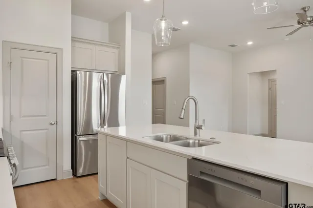 a bathroom with a sink double vanity and a mirror