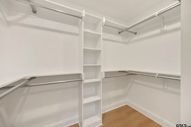 a view of an empty walk in closet