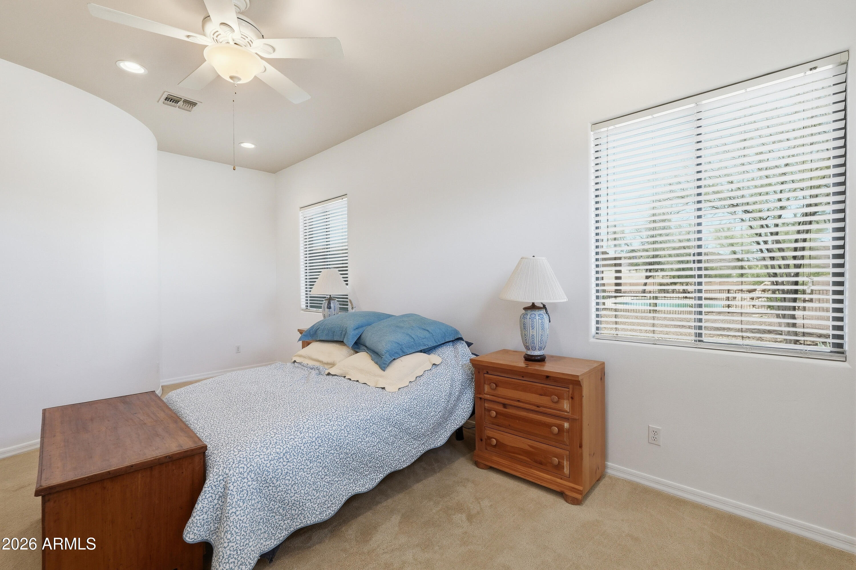 2616 West Canyon Road Phoenix, AZ 85086 - Photo 38 of 45 a bedroom with a bed and a window