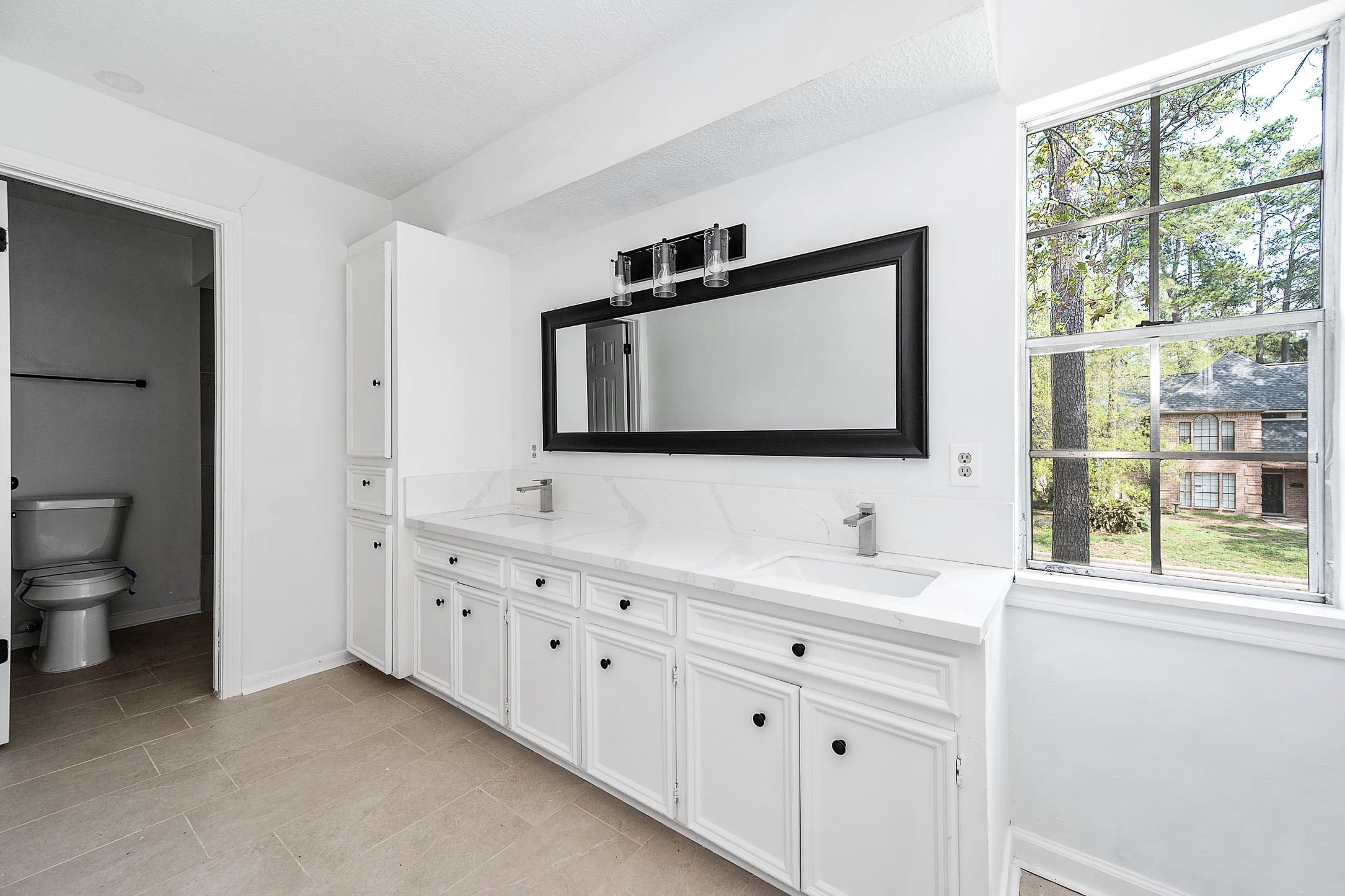 17627 Terrawren Lane Spring, TX 77379 - Photo 26 of 30 a bathroom with a toilet sink and mirror
