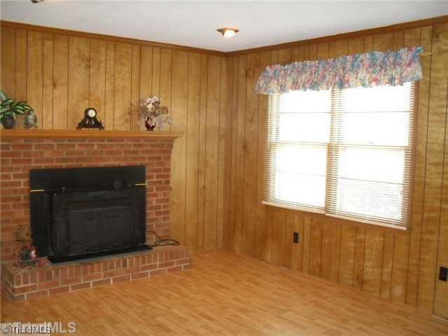691 Allred Road Lexington, NC 27292 - Photo 8 of 16 Living Room. The main living room has laminate floors and a woodstove all added within 5 years