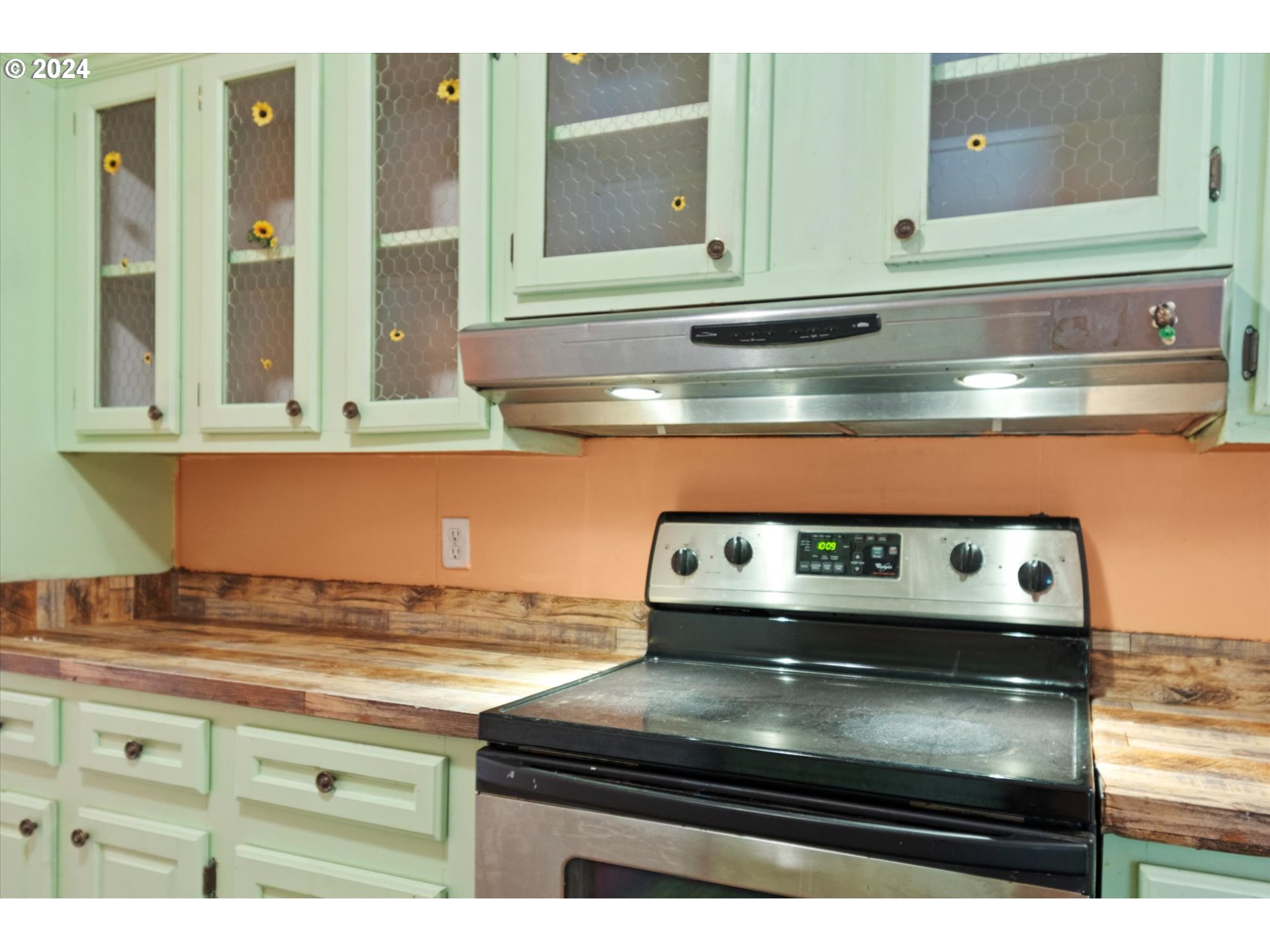 29643 View Street Rainier, OR 97048 - Photo 11 of 31 a stove top oven sitting inside of a kitchen