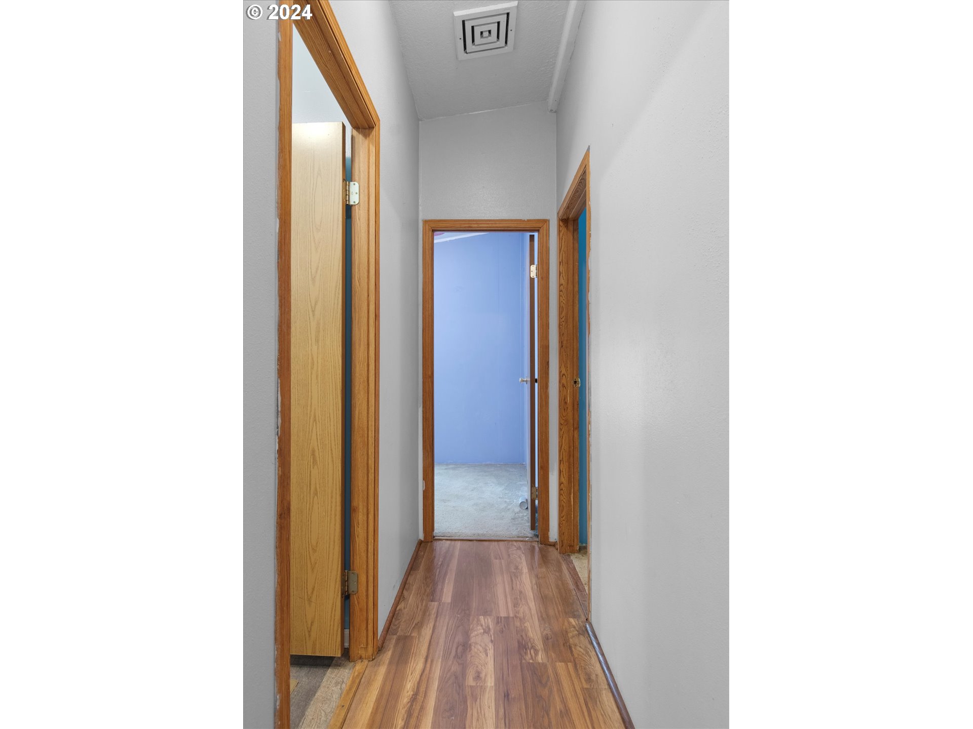 29643 View Street Rainier, OR 97048 - Photo 15 of 31 a view of a hallway with wooden floor