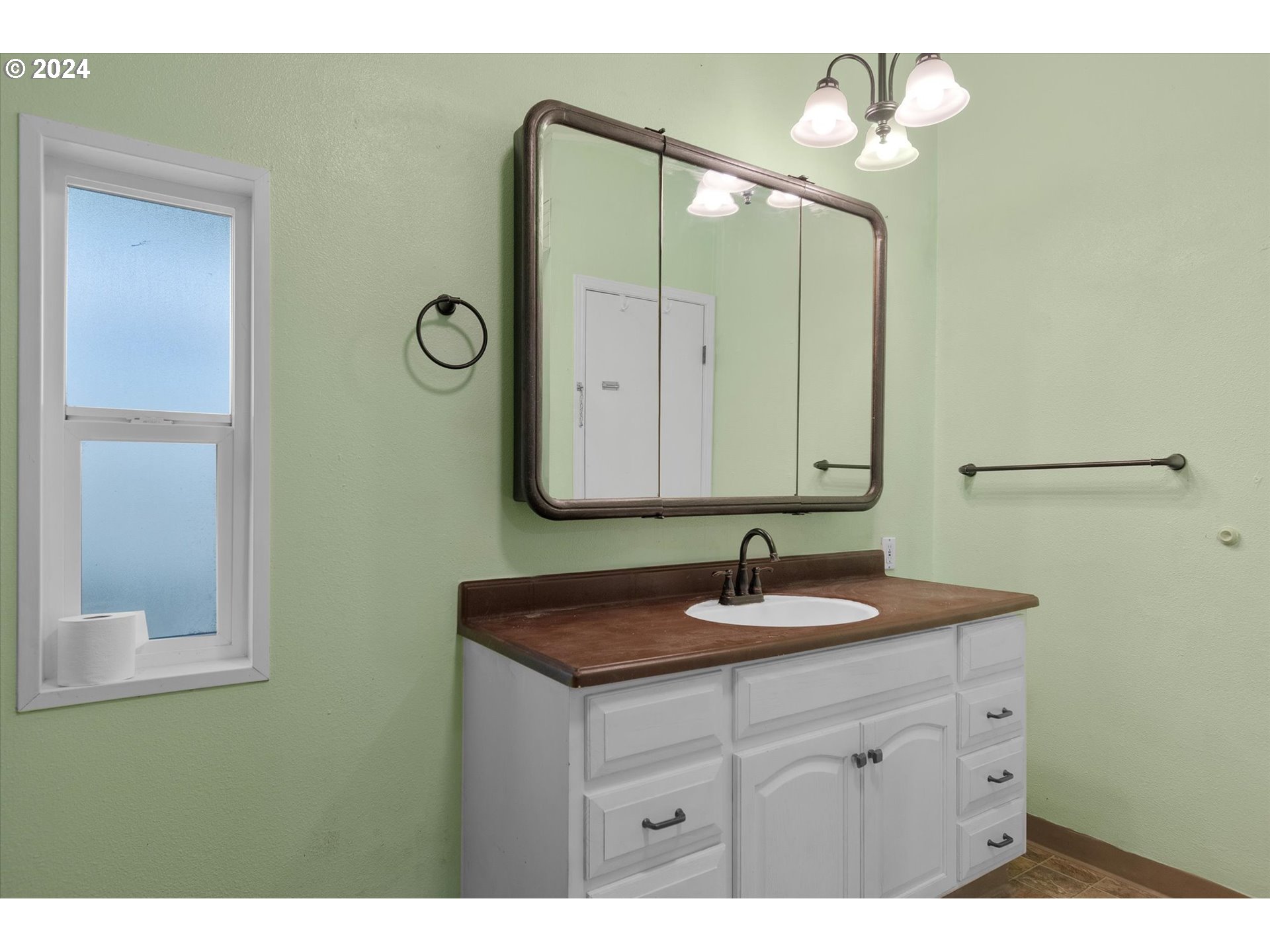29643 View Street Rainier, OR 97048 - Photo 20 of 31 a bathroom with a sink and a mirror