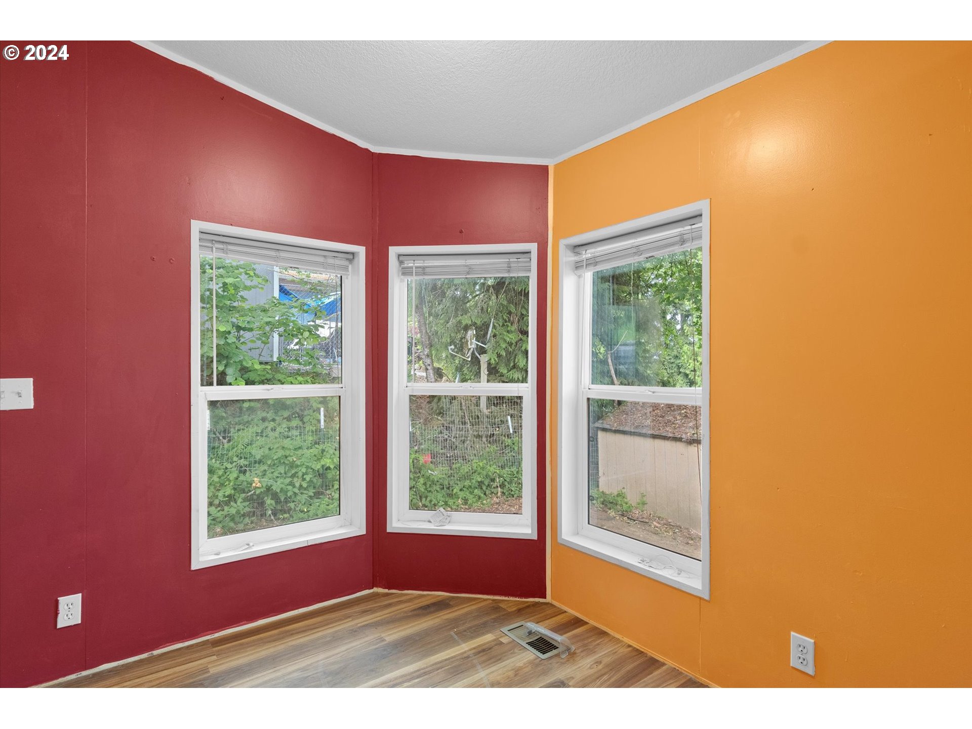 29643 View Street Rainier, OR 97048 - Photo 8 of 31 a view of a big room with wooden floor and windows