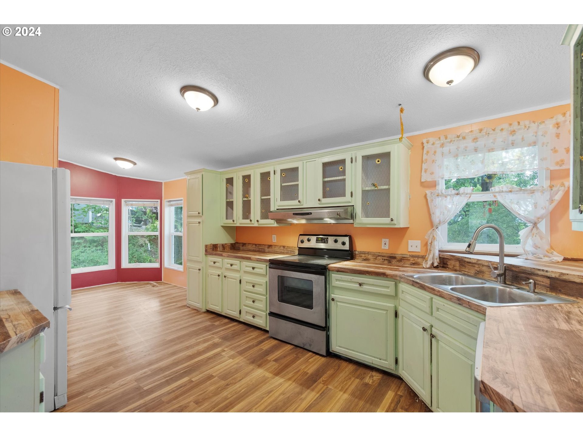 29643 View Street Rainier, OR 97048 - Photo 9 of 31 a kitchen with stainless steel appliances granite countertop a stove and cabinets