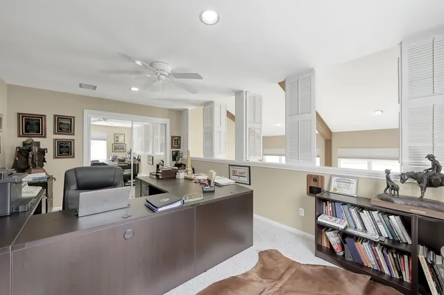 a very nice looking living room with furniture and a large window