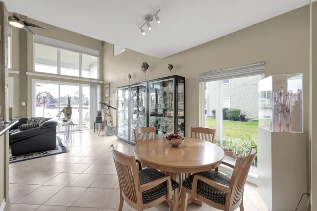 a view of a dining room with furniture window and outside view